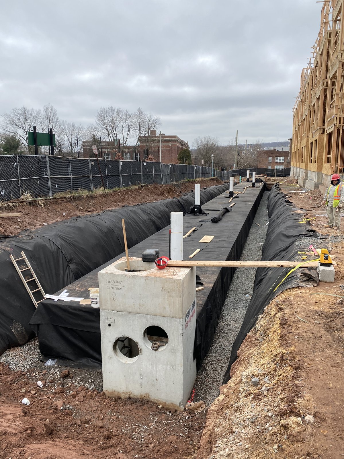 Egg-crate StormTech chambers being placed in the trench.