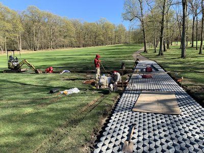 Cart-path matting install along the fairway at Crestmont.