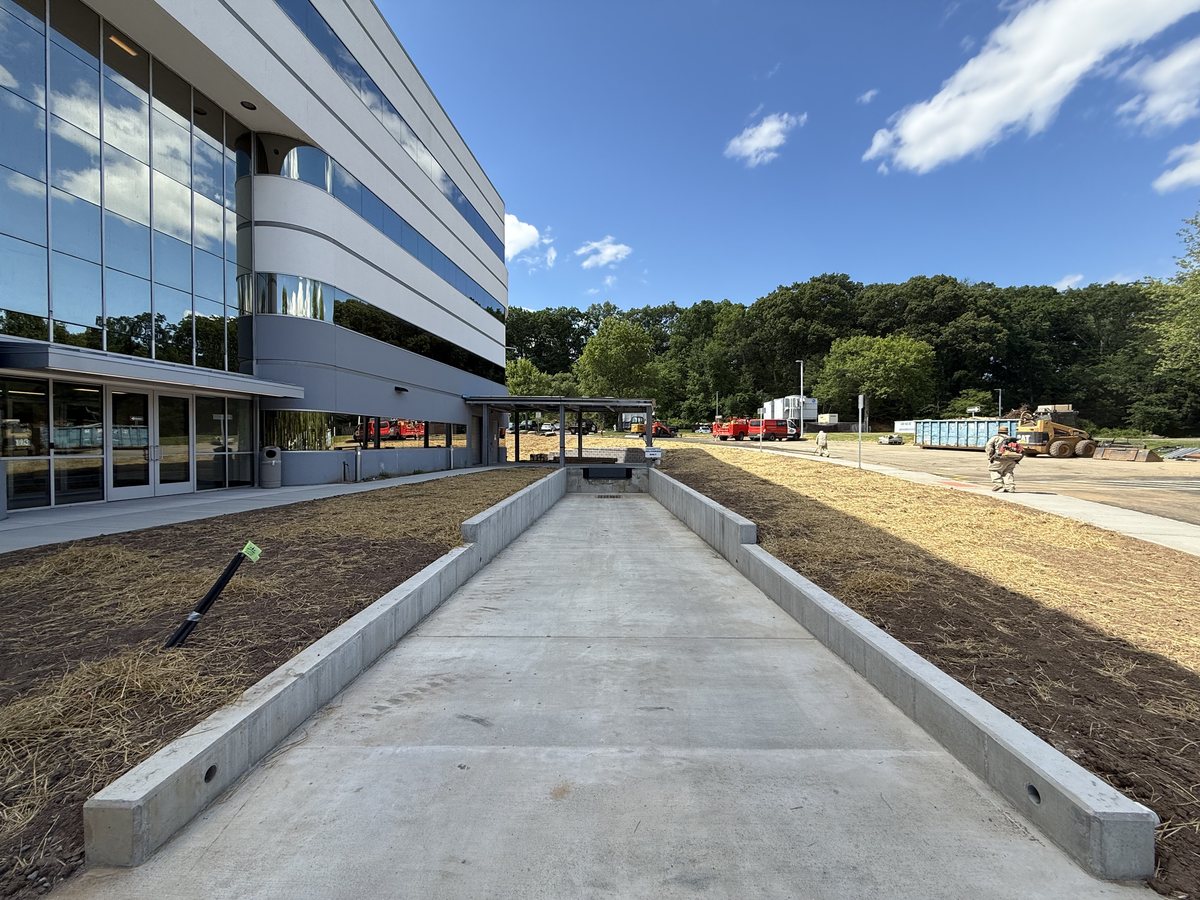New concrete loading-dock ramp with cast-in-place side walls at the Marotta Controls headquarters in Montville, NJ.