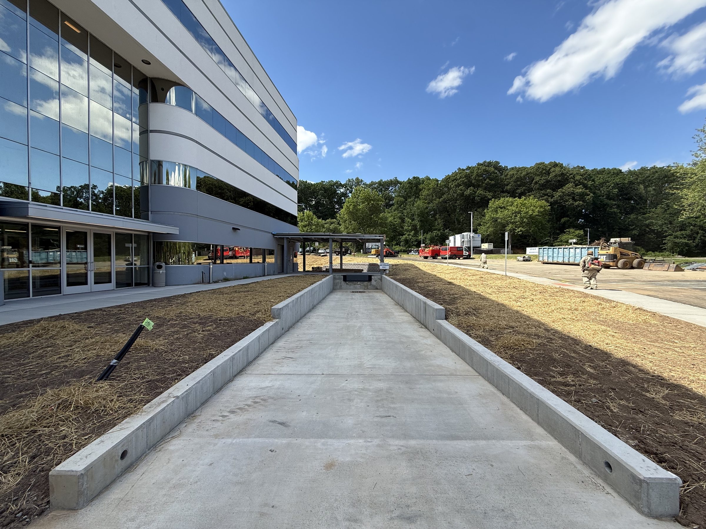 New concrete loading-dock ramp with cast-in-place side walls at the Marotta Controls headquarters in Montville, NJ.