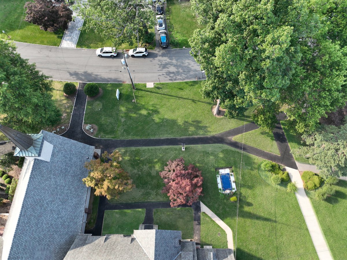 Newly paved asphalt walking paths crossing the church lawn at St. Joseph's.