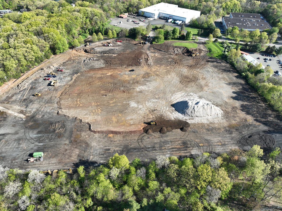 Aerial drone view of the active warehouse jobsite in Parsippany, NJ — mass earthwork in progress.
